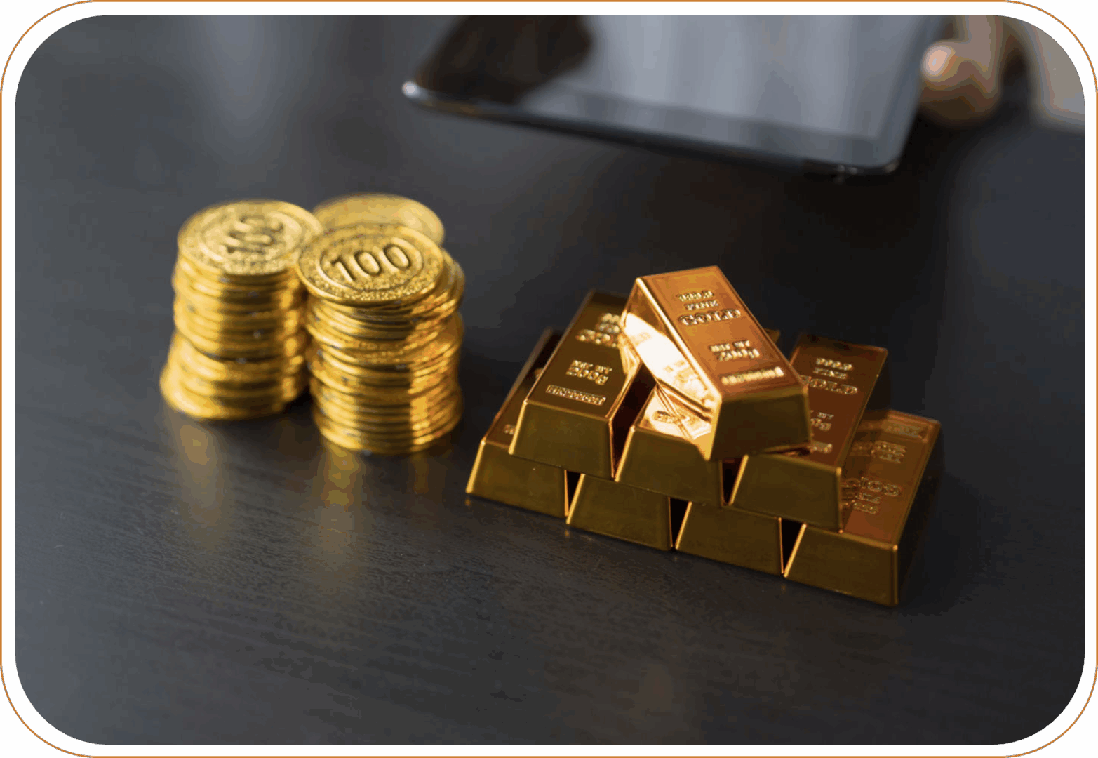Stacked gold coins next to bars.
