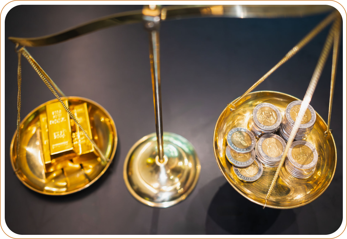 Gold bars and coins on balance scale